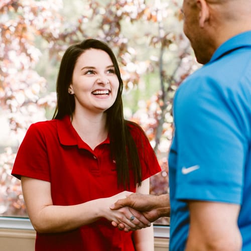 Canopy cu staff member shaking customer's hand