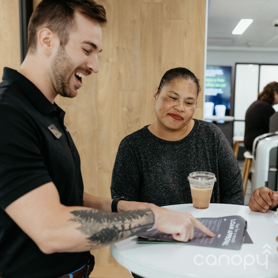 financial coach helping a credit union member