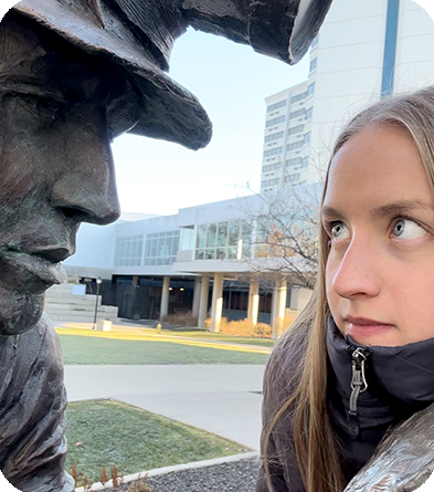 image of a women trying to win a staring contest with a statue