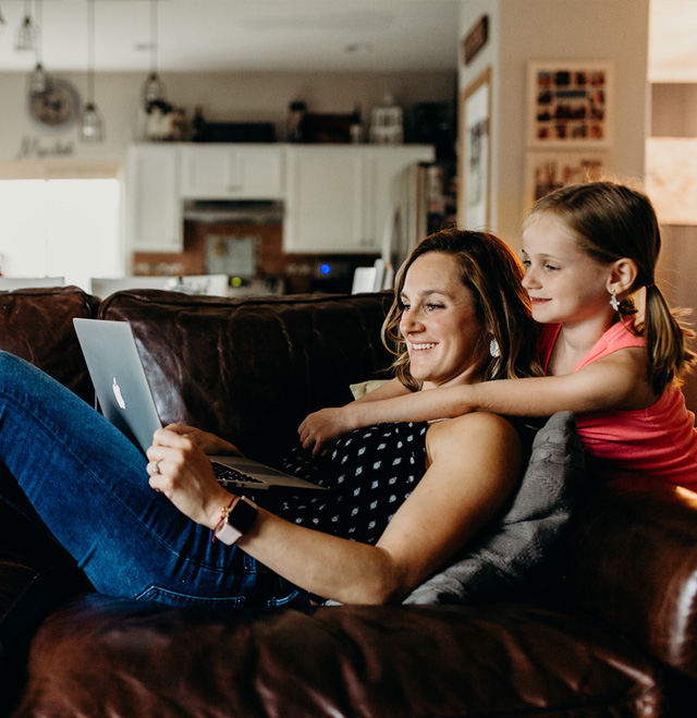 woman with daughter applying online